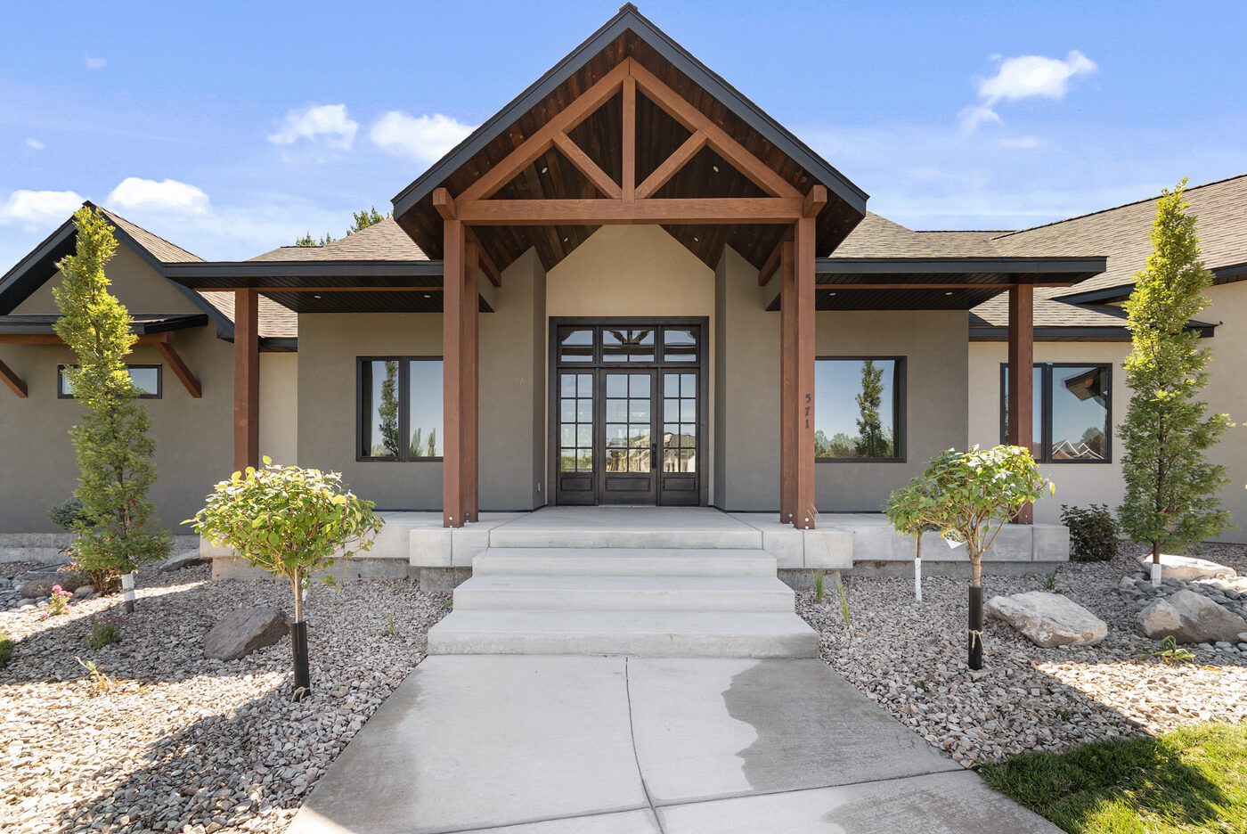 Covered timber-frame entry of 571 Partridge Lane
