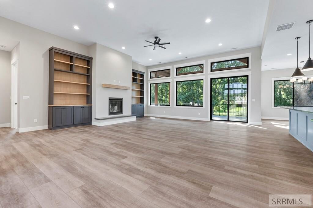 Living room with gas fireplace and built-in shelving